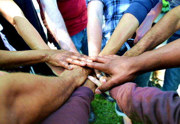 diverse-group-buy-in-all-hands-huddle